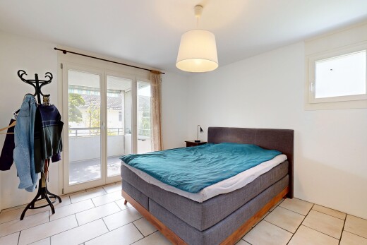 room with access to exterior, decorative light fixtures, and light tile patterned floors