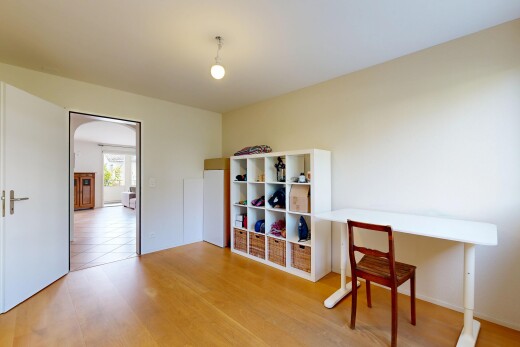 dining area with light wood-type flooring and arched walkways