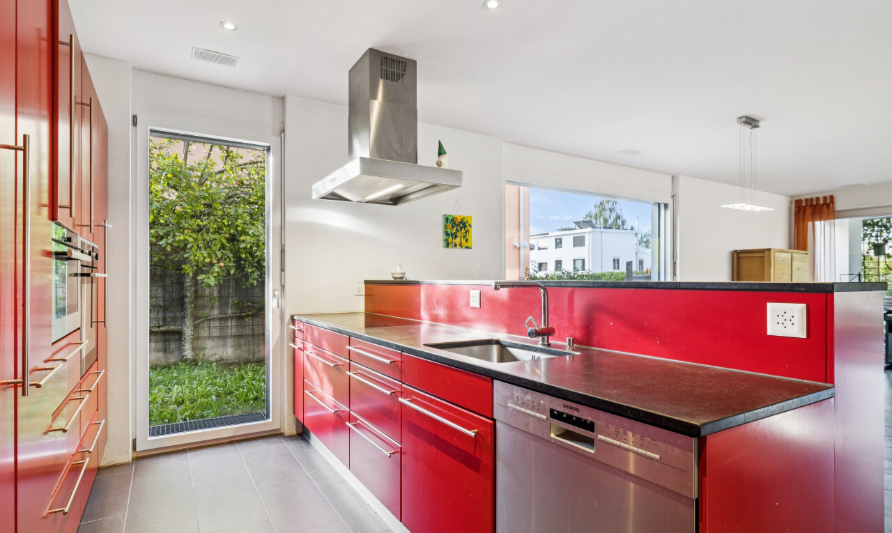 kitchen featuring island range hood, access to exterior, stainless steel dishwasher, recessed lighting, and bold wood finish cabinets