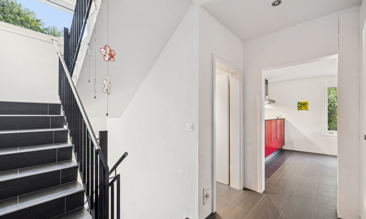 stairway featuring plenty of natural light