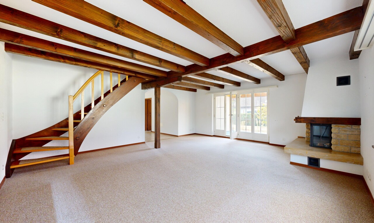 leerer raum mit balkendecke, beamed ceiling, treppen, kamin, und gipskartonwand