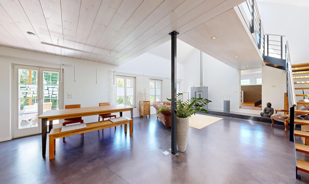 rezeption / lobby mit finished concrete floor, concrete floor, französische türen, natural light, und wood ceiling