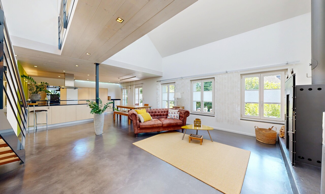 wohnzimmer mit finished concrete floor, betonboden, concrete floor, inside property, und gipskartonwand