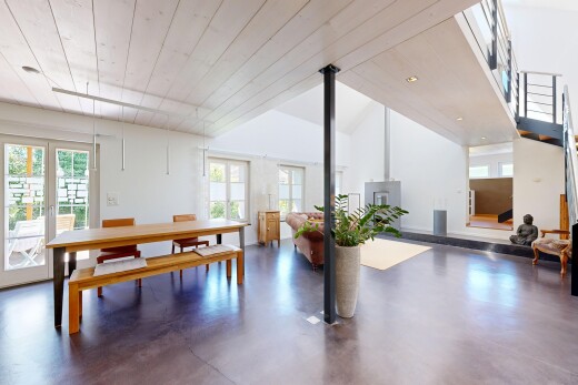 rezeption / lobby mit finished concrete floor, concrete floor, französische türen, natural light, und wood ceiling