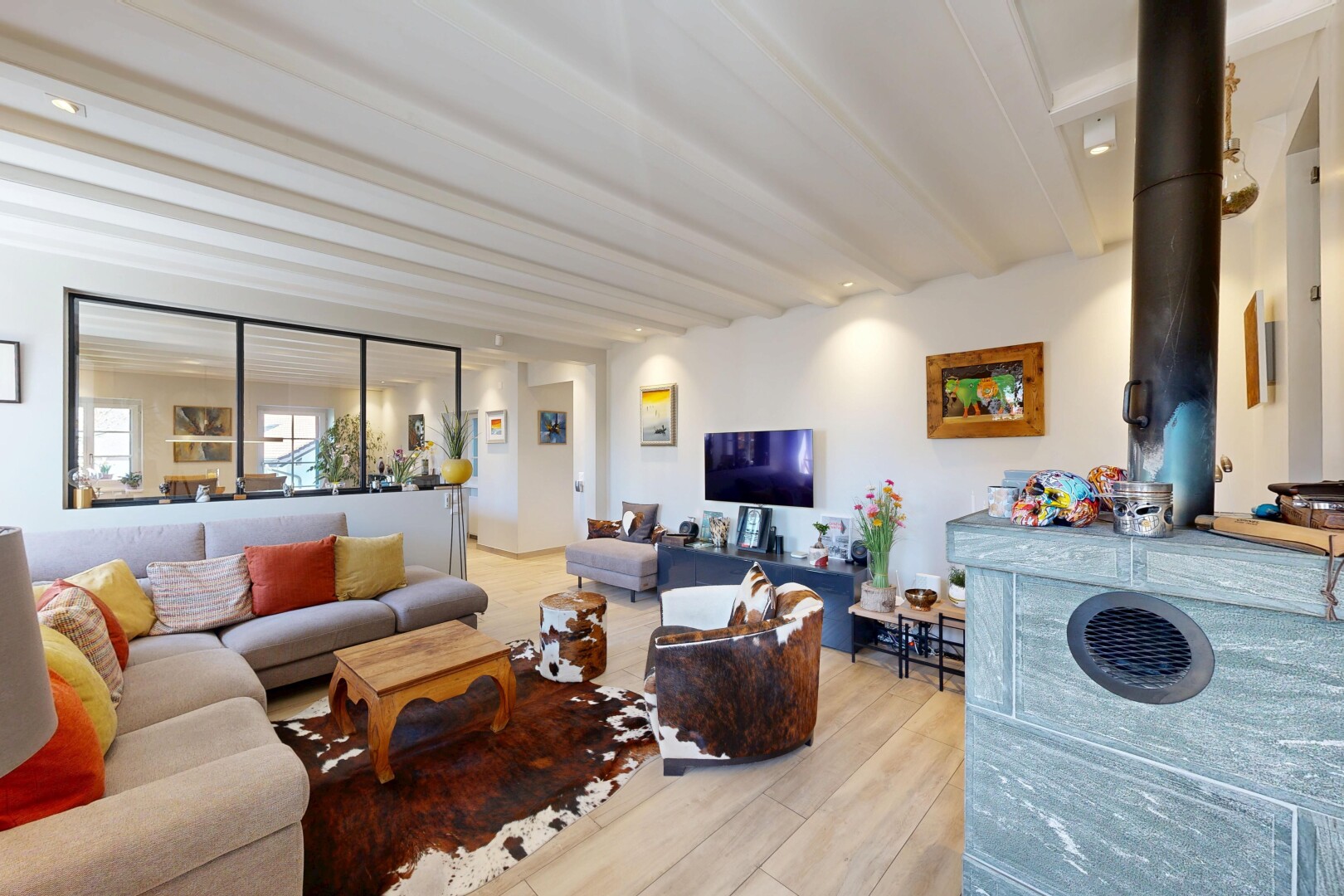 living room featuring beam ceiling, light wood finished floors, and recessed lighting
