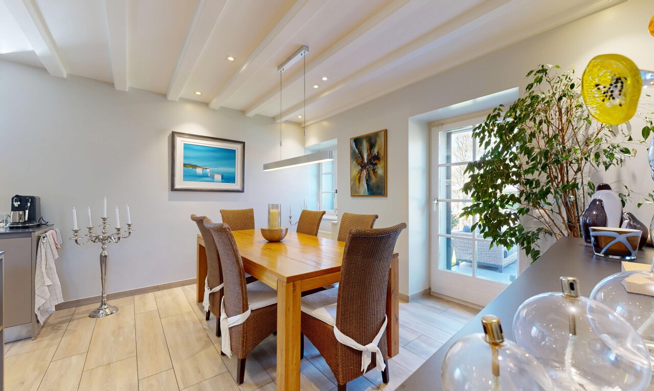dining area with light wood-style floors, recessed lighting, and beam ceiling