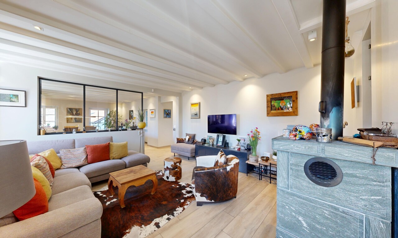 living room featuring beam ceiling, light wood finished floors, and recessed lighting