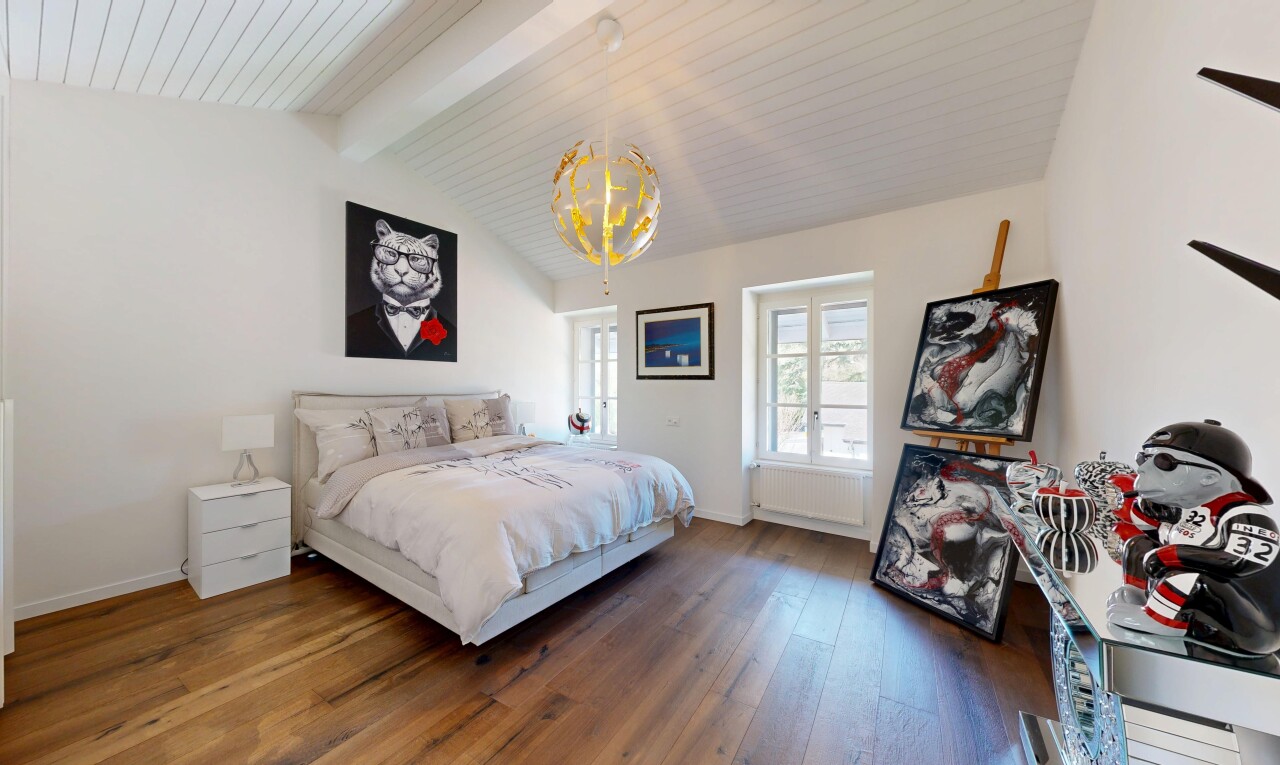 room / bedroom with dark wood-type flooring, beam ceiling, and a chandelier
