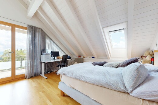 zimmer / schlafzimmer mit beamed ceiling, balkendecke, zusätzliches zimmer, vaulted ceiling, und dachschräge