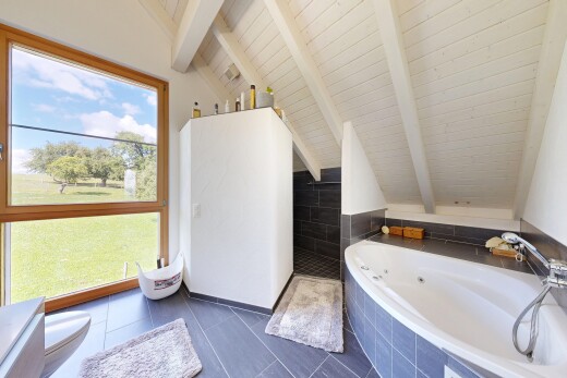 full bath featuring lofted ceiling with beams, a walk in shower, a whirlpool tub, wood ceiling, and dark tile patterned flooring