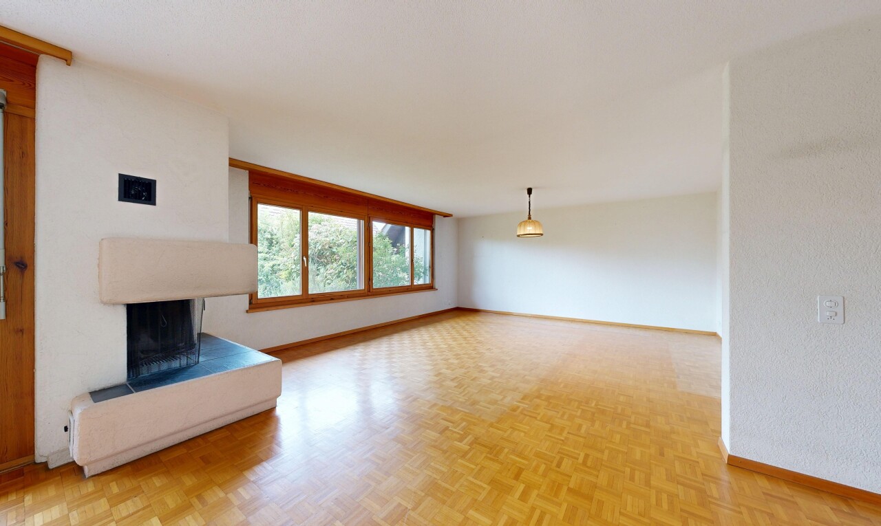 leerer raum mit inside property, holzfußboden, wood finish floor, kamin, und parquet floor