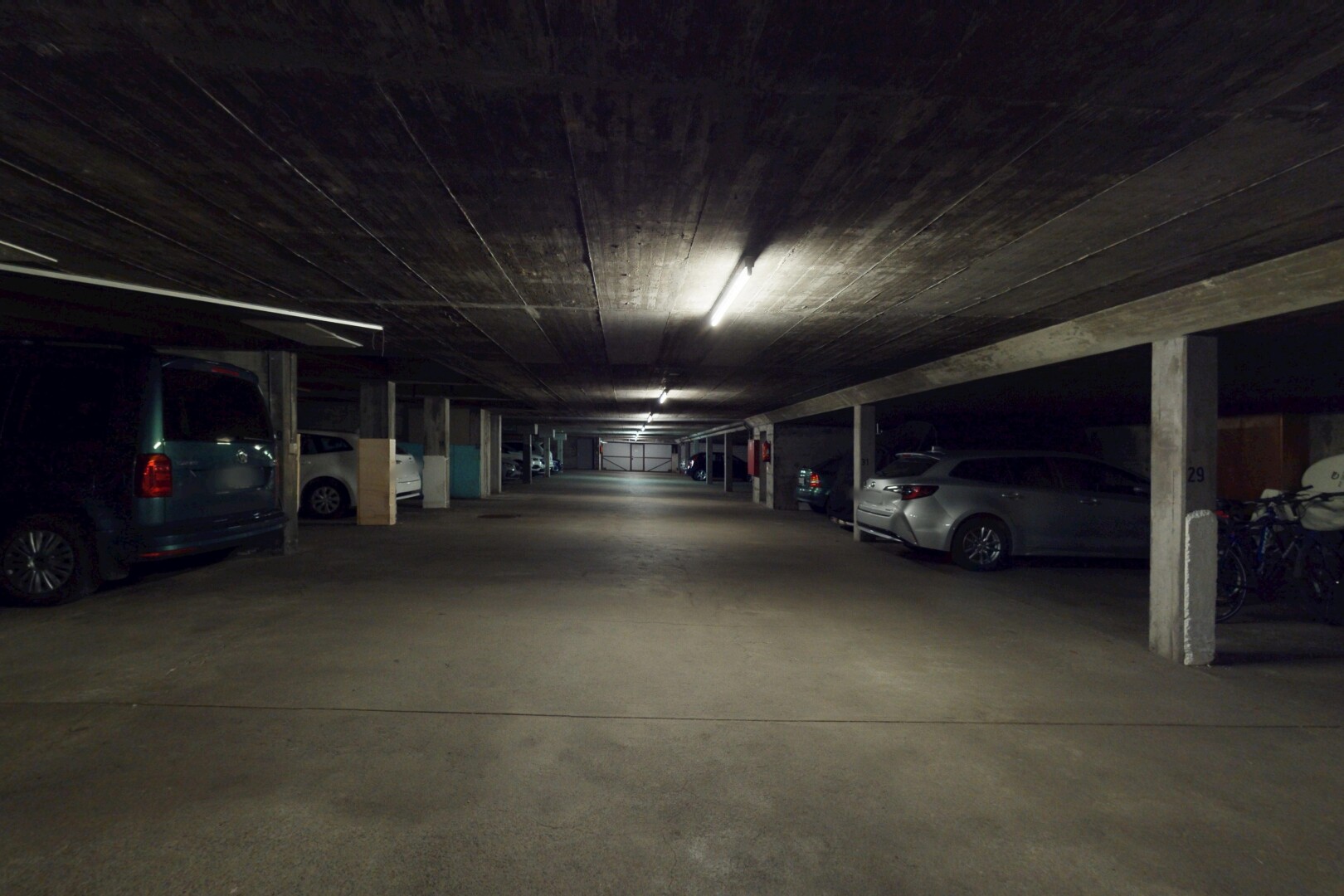view of car parking with a parking deck