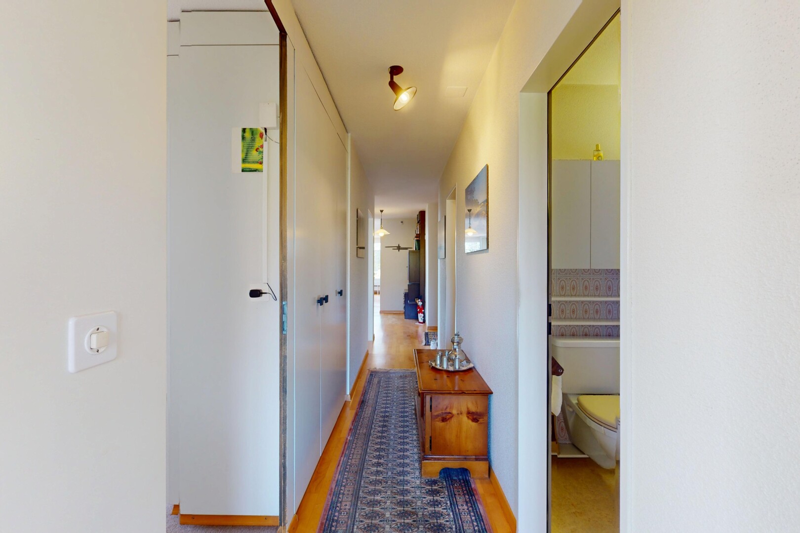 corridor featuring light wood-style flooring