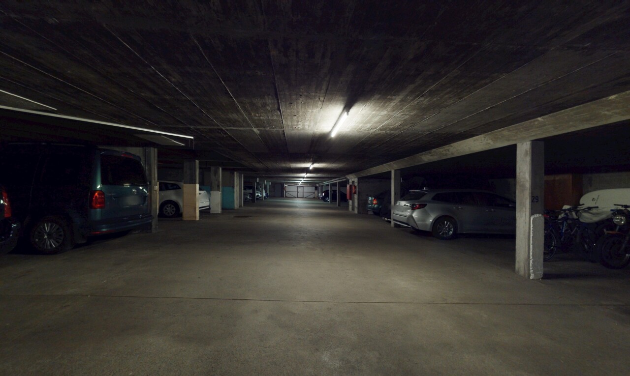 view of car parking with a parking deck