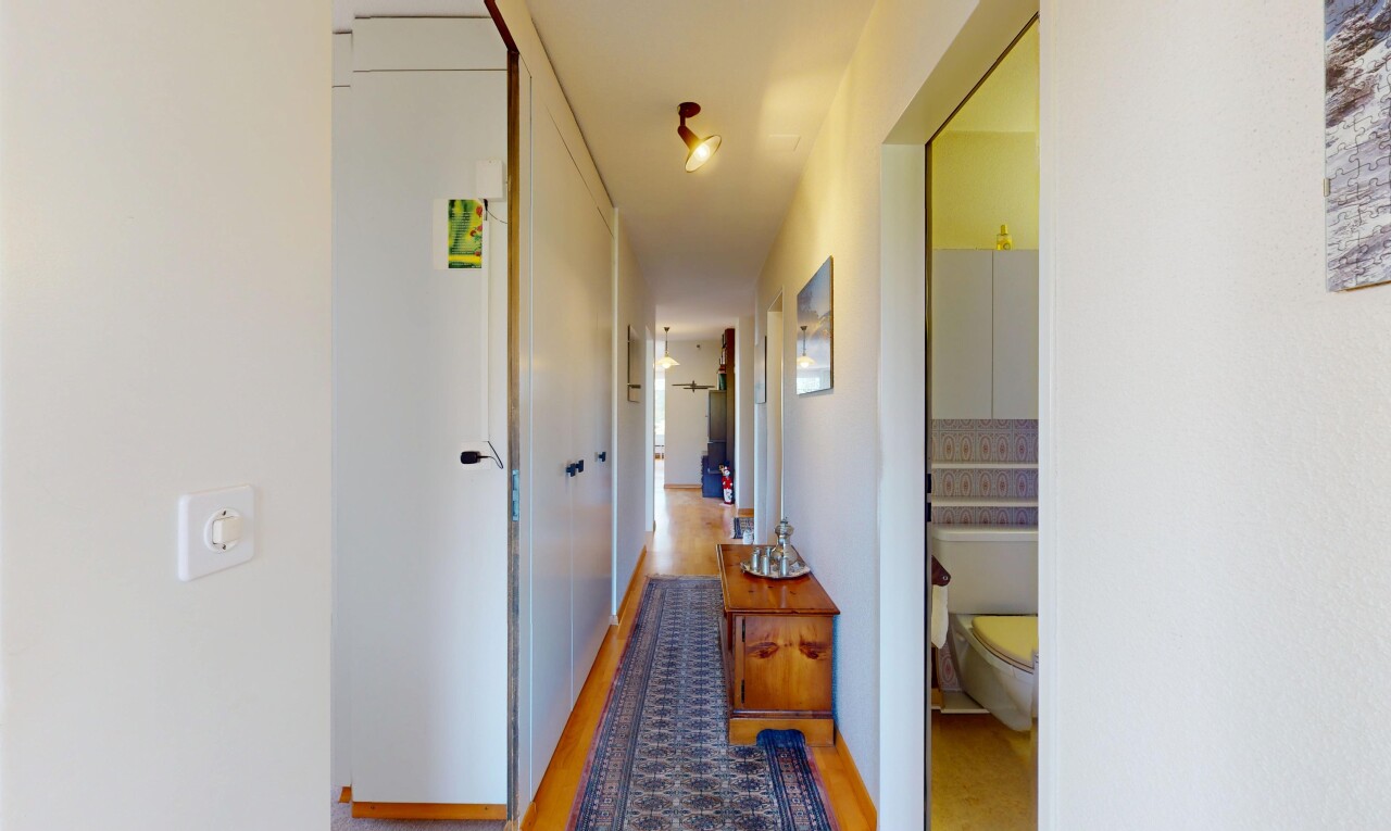 corridor featuring light wood-style flooring