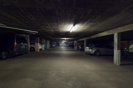 view of car parking with a parking deck