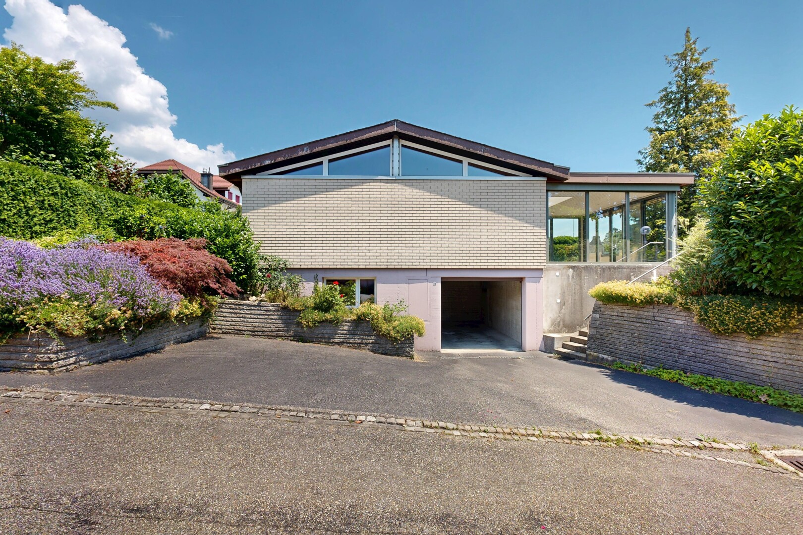 view of home featuring a garage and driveway