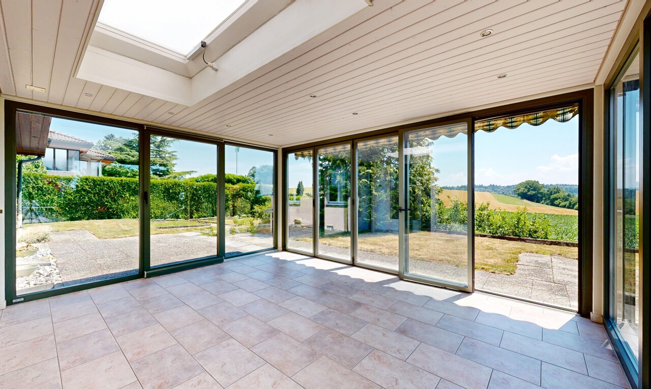welcome area / lobby with floor to ceiling windows and a skylight