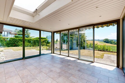 welcome area / lobby with floor to ceiling windows and a skylight