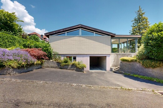view of home featuring a garage and driveway