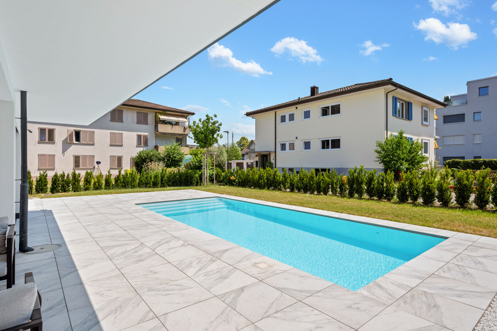 schwimmbad mit day time, schwimmbad, terrasse, from property, und rasen