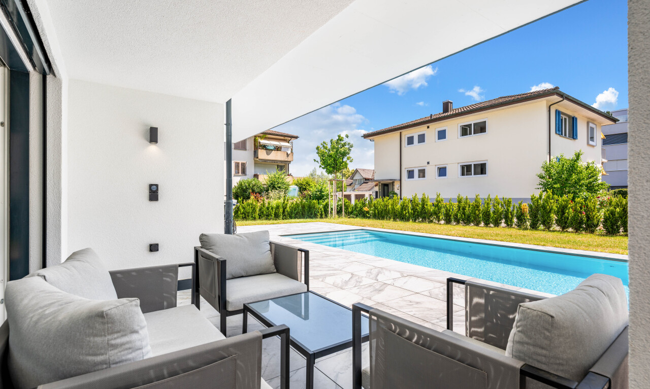 outdoor pool featuring outdoor furniture and a patio