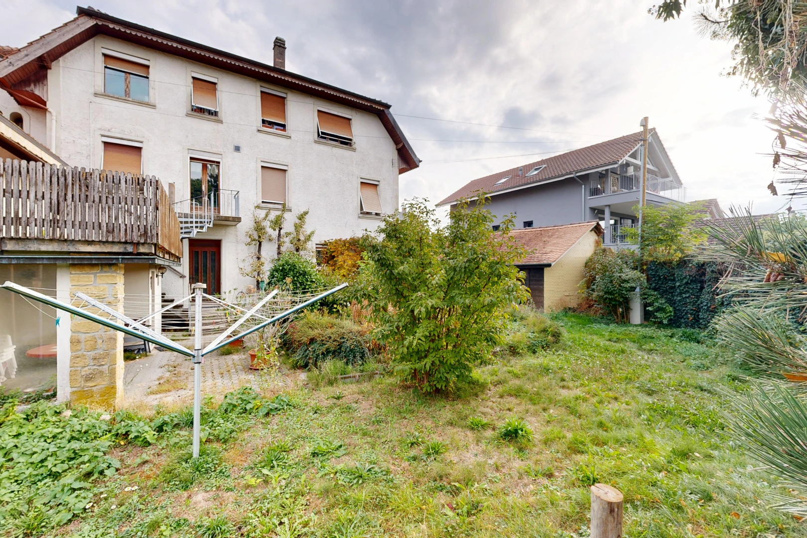 outdoor house featuring a chimney