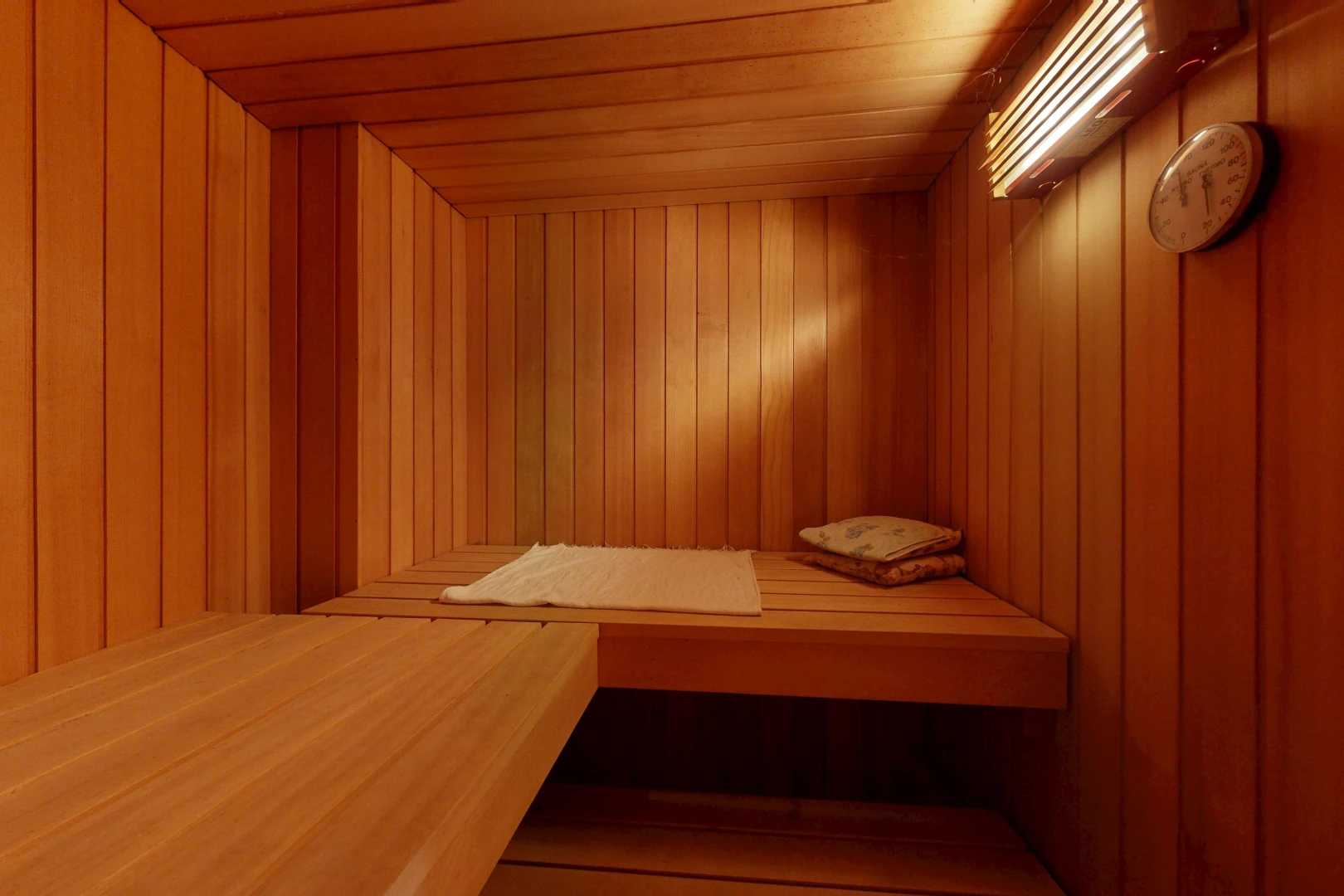detailed view of wood walls, a sauna, and wooden ceiling