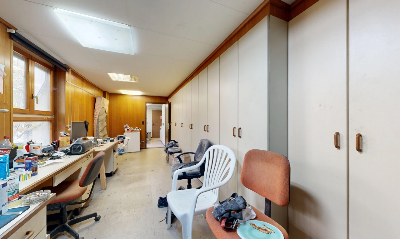 office featuring built in study area and wood walls