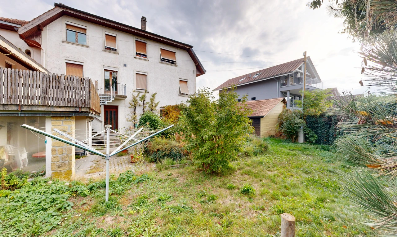 outdoor house featuring a chimney