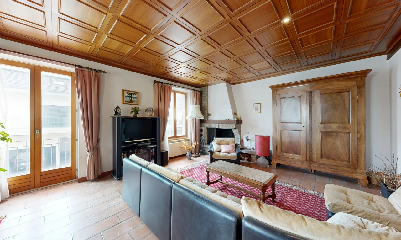 living room with a fireplace and access to exterior