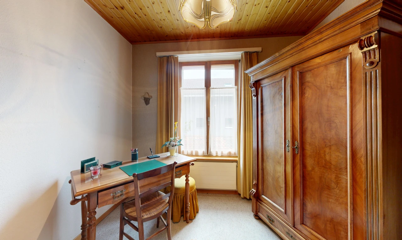 office area with wood ceiling and light colored carpet