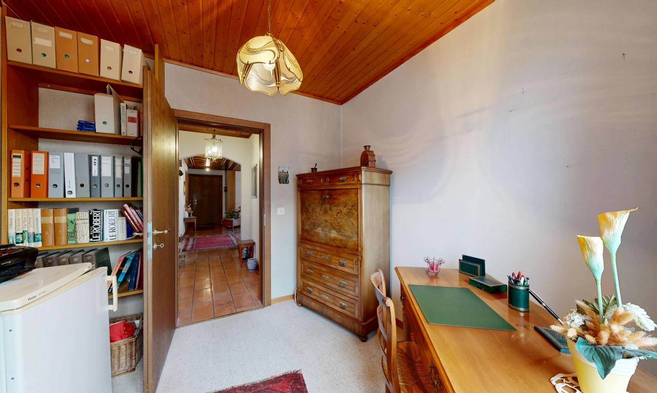 office area featuring wooden ceiling, light colored carpet, and pendant lighting