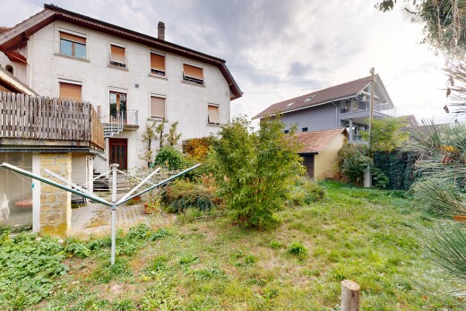 outdoor house featuring a chimney