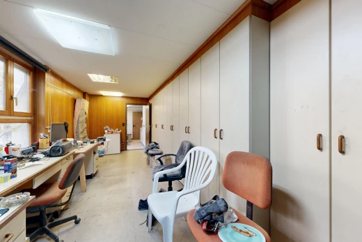 office featuring built in study area and wood walls
