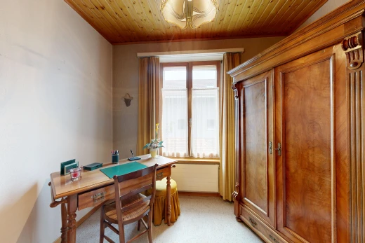 office area with wood ceiling and light colored carpet