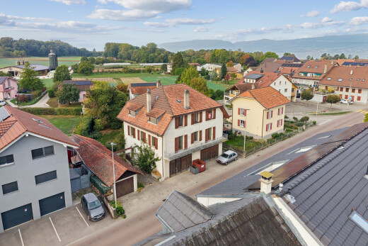 view of home featuring a residential view and a chimney