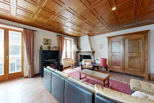 living room with a fireplace and access to exterior