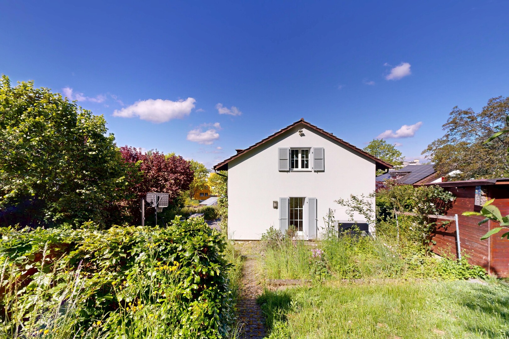 façade avec property visible, day time, et bardage en stuc
