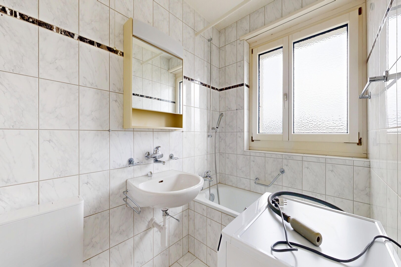 full bath with a garden tub and tile walls