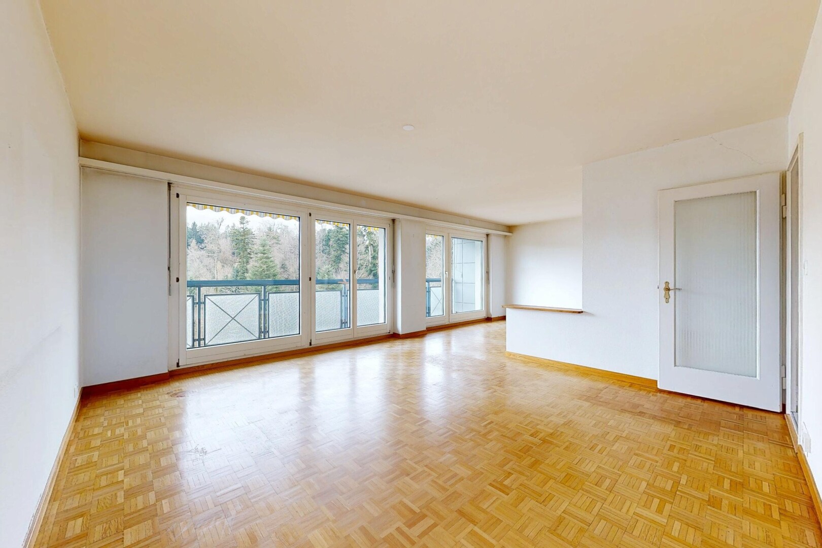 spare room with parquet flooring and baseboards