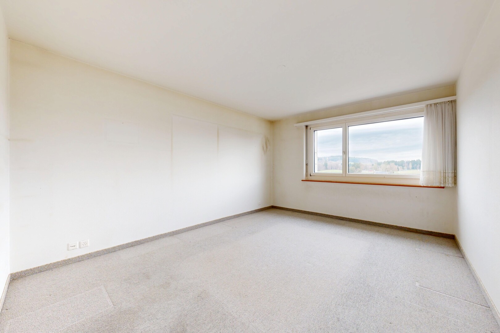 spare room with light carpet