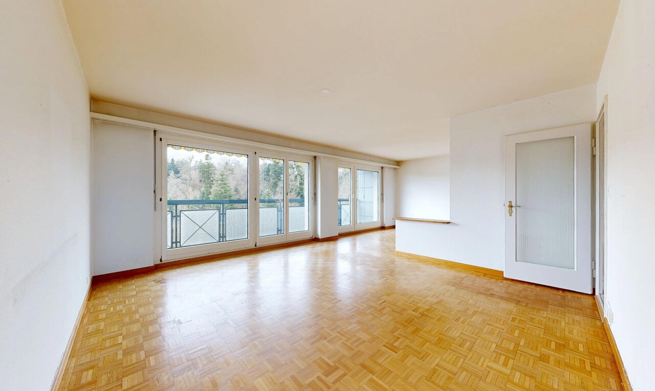 spare room with parquet flooring and baseboards