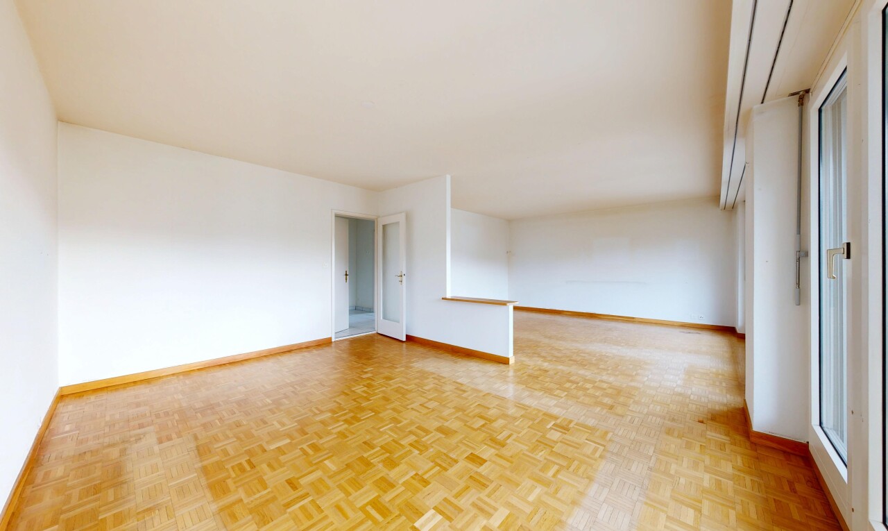 spare room with parquet floors and baseboards