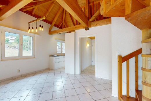 leerer raum mit natürliches licht, beamed ceiling, balkendecke, inside property, und vaulted ceiling