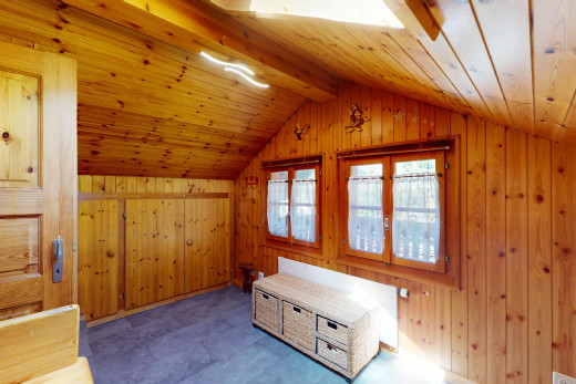 interior space featuring wooden walls, tile patterned flooring, vaulted ceiling, and wood ceiling