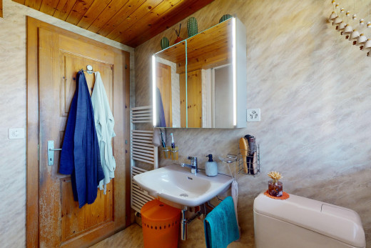 bathroom featuring sink and toilet