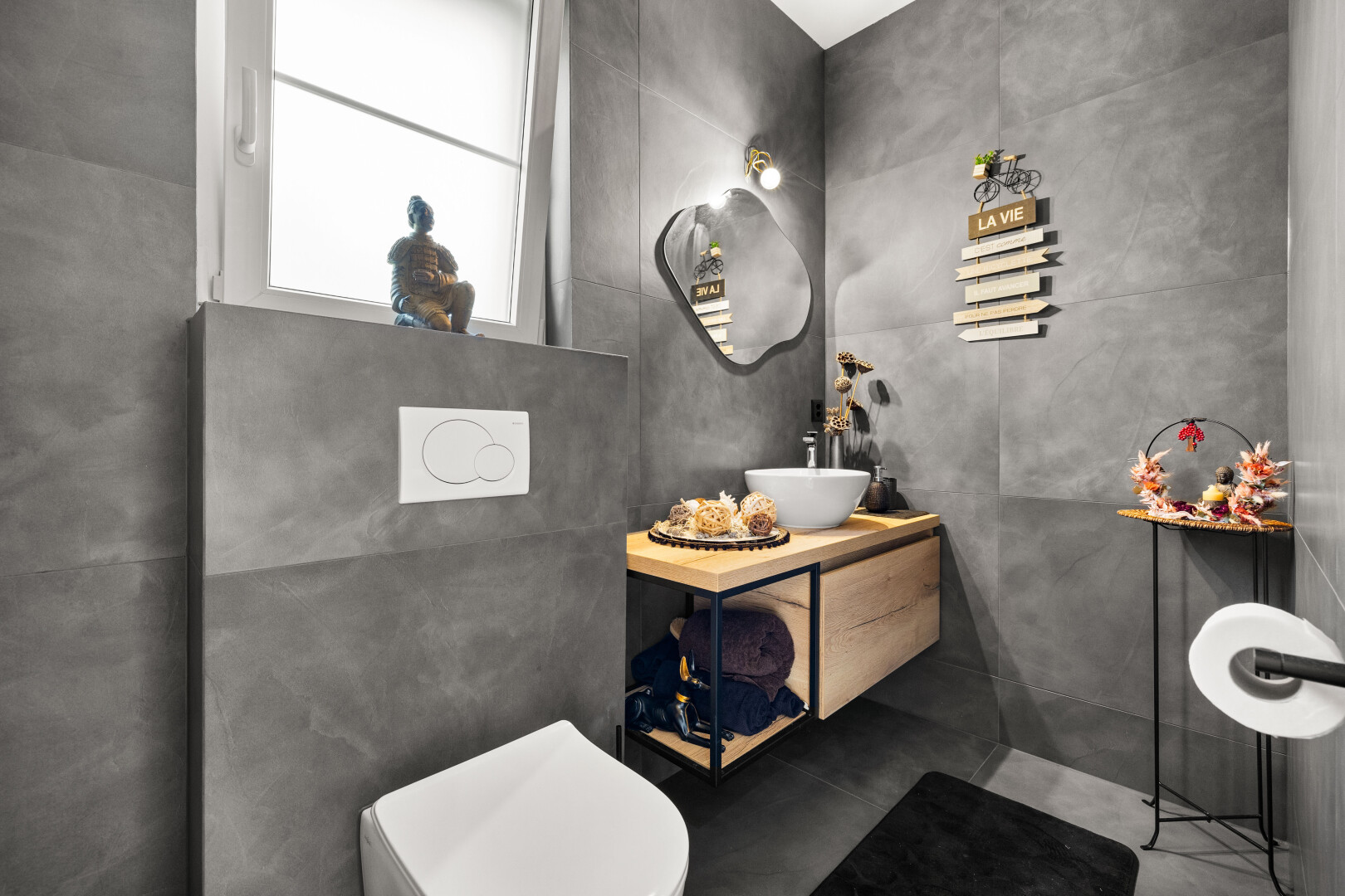 half bathroom with vanity and toilet