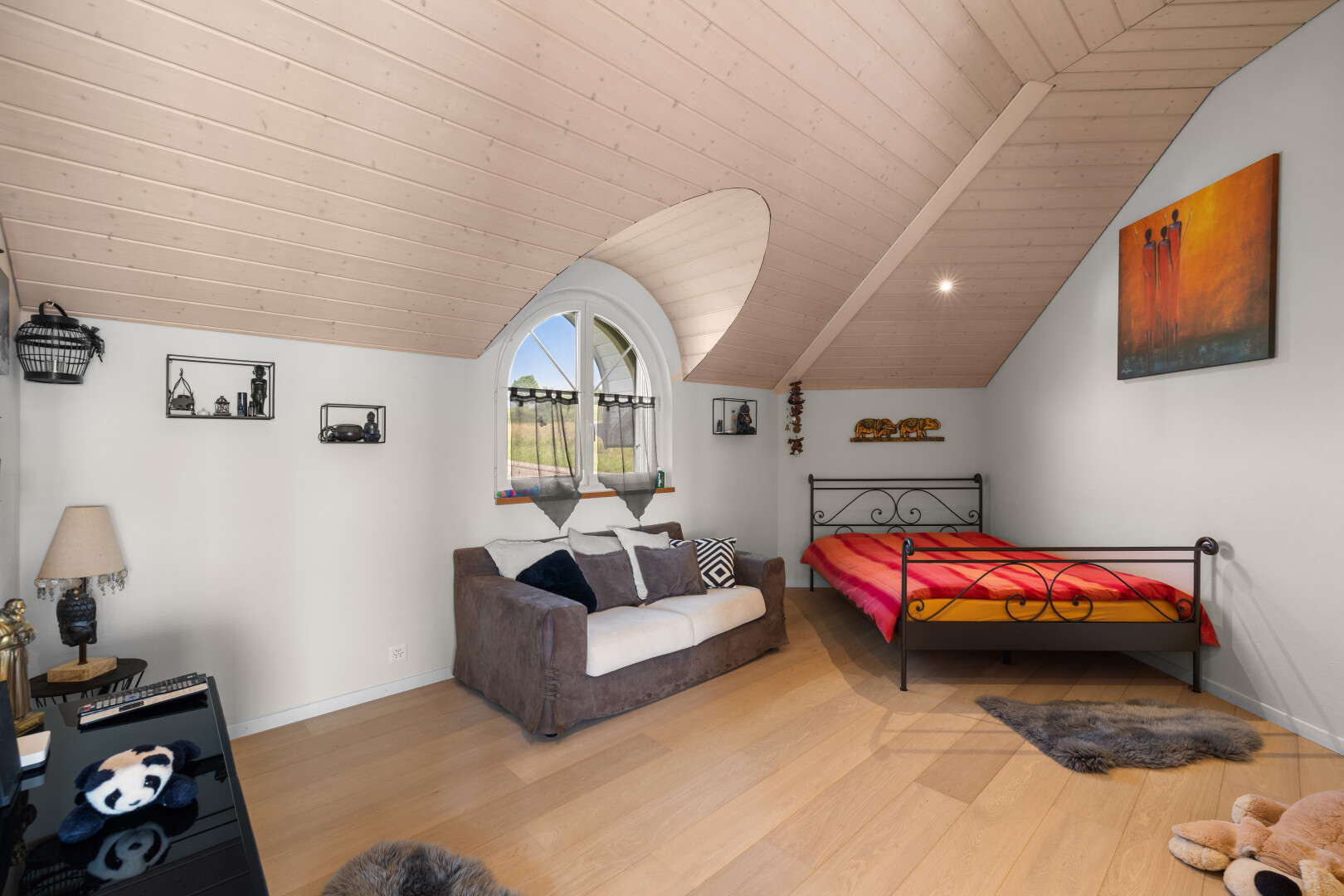 room / bedroom featuring vaulted ceiling, wood finished floors, and wooden ceiling