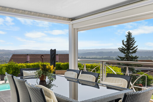 patio / terrace featuring a balcony and outdoor dining area